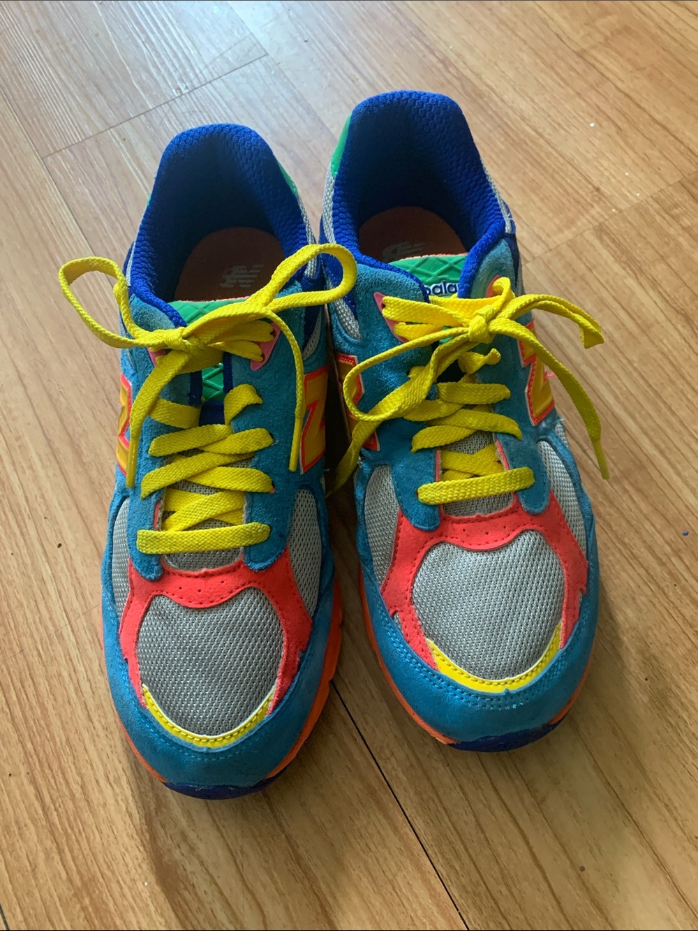 New Balance Kids Blue Sneakers with Yellow Laces and Pink Accents